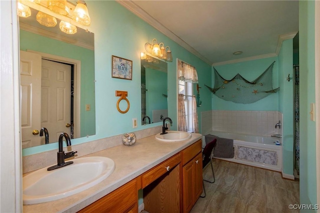 bathroom with a bath, crown molding, and vanity