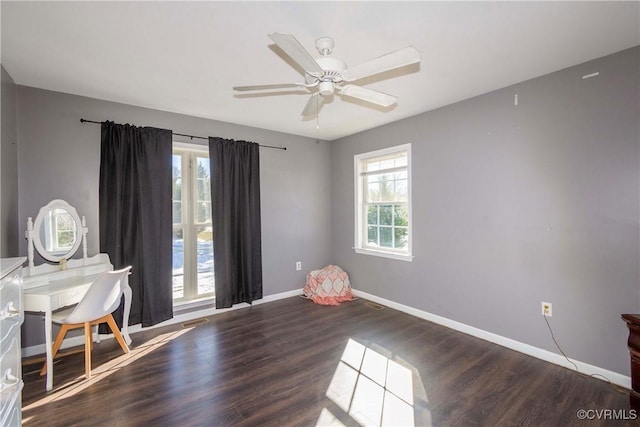 interior space with ceiling fan, dark hardwood / wood-style floors, and plenty of natural light