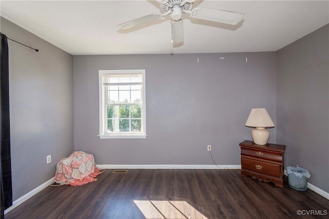 interior space featuring ceiling fan and dark hardwood / wood-style floors