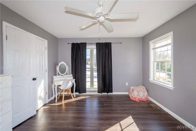 interior space featuring ceiling fan and dark hardwood / wood-style floors