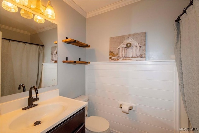 bathroom with toilet, ornamental molding, walk in shower, and vanity