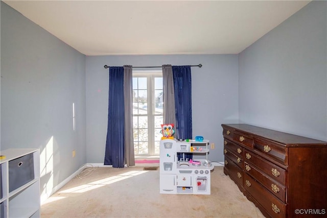 game room featuring light colored carpet