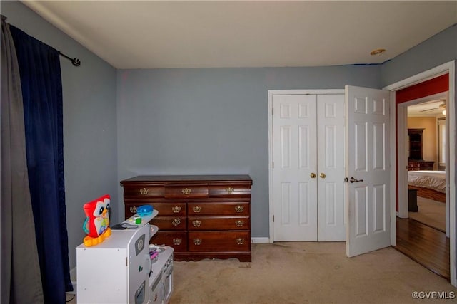 carpeted bedroom with a closet