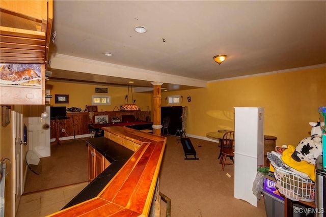 game room with ornamental molding, light colored carpet, and bar