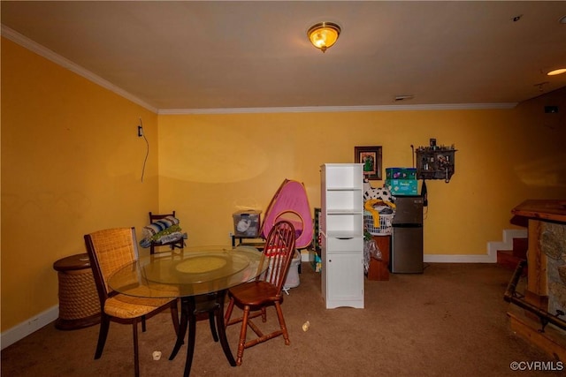 dining room with carpet and crown molding