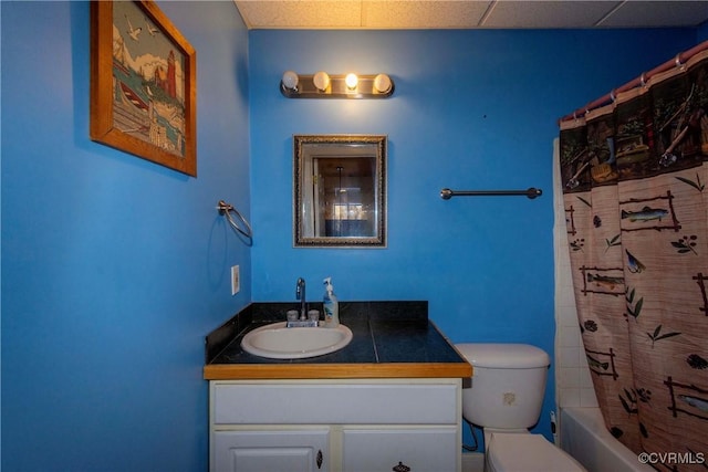 full bathroom featuring toilet, shower / bathtub combination with curtain, and vanity