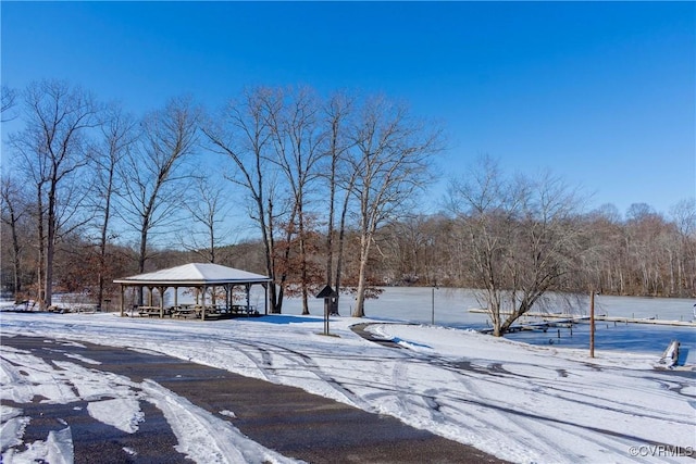 snowy yard featuring a gazebo