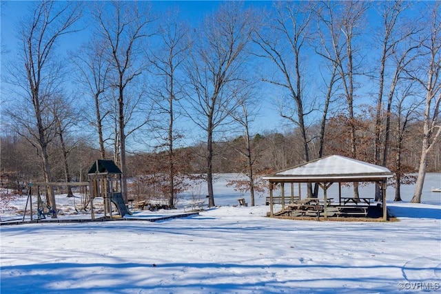 view of property's community with a playground and a gazebo