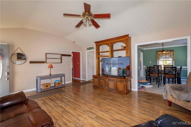 living room featuring ceiling fan with notable chandelier, wood-type flooring, and lofted ceiling