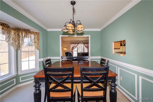 dining room featuring a notable chandelier and crown molding