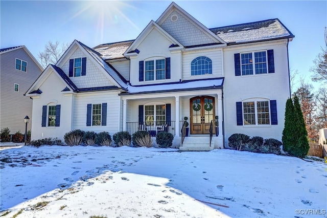 view of front of house featuring covered porch and french doors