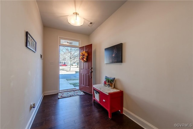 foyer entrance with dark hardwood / wood-style floors