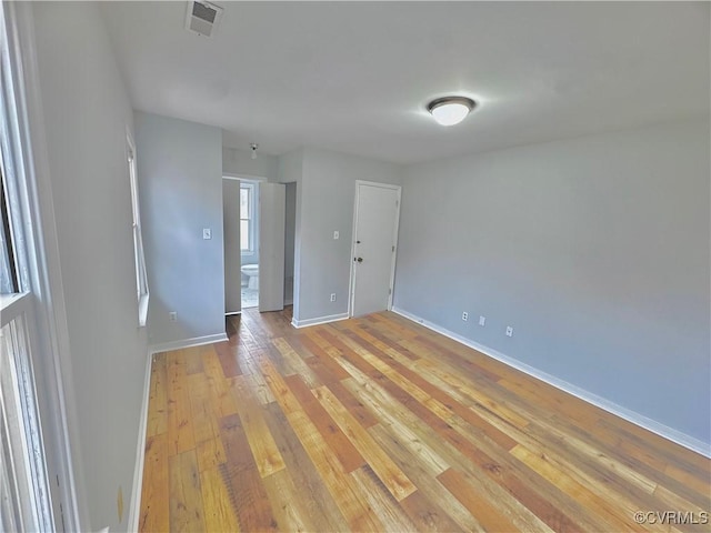 unfurnished room featuring light wood-type flooring