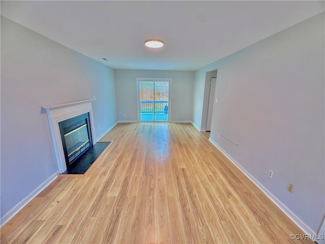 unfurnished living room with light hardwood / wood-style floors