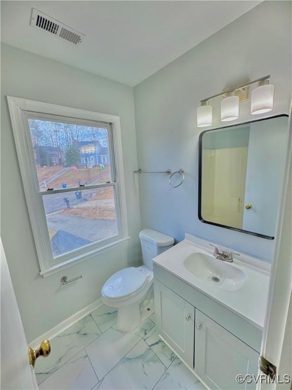 bathroom with toilet and vanity