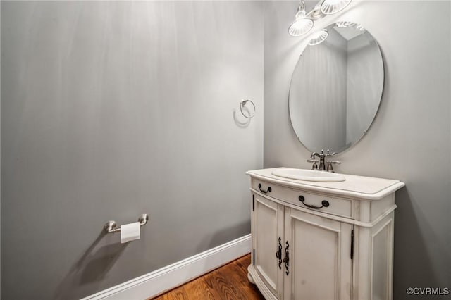 bathroom featuring vanity and hardwood / wood-style floors