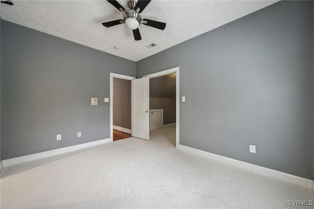 unfurnished bedroom with light carpet and ceiling fan