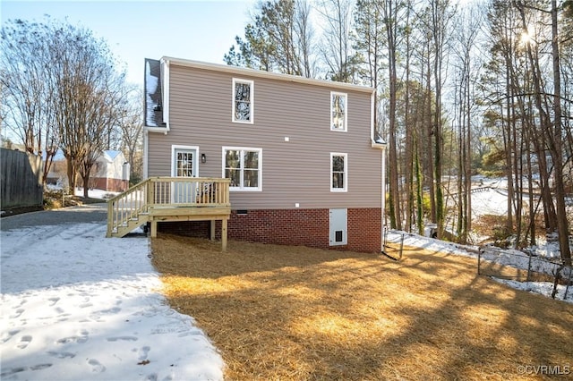 view of snow covered house