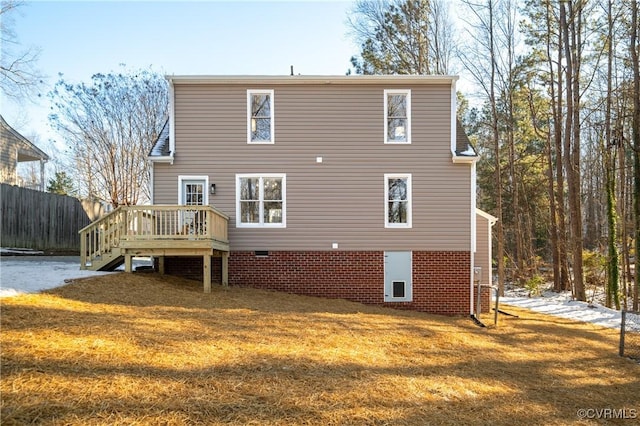 rear view of property featuring a yard