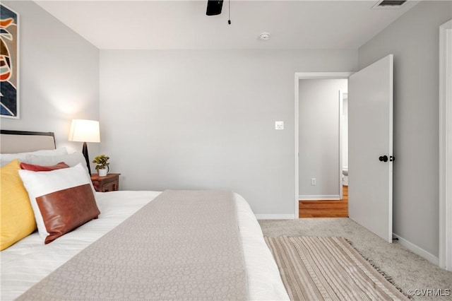 carpeted bedroom with ceiling fan