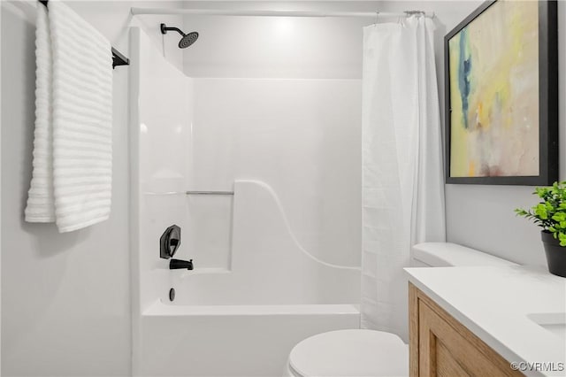 full bathroom featuring shower / bathtub combination with curtain, vanity, and toilet