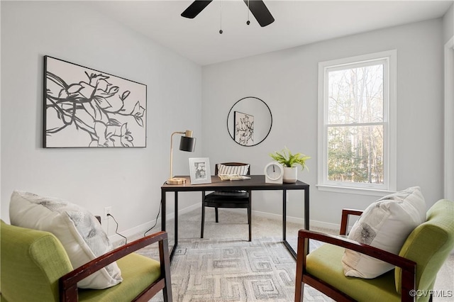 carpeted home office with ceiling fan