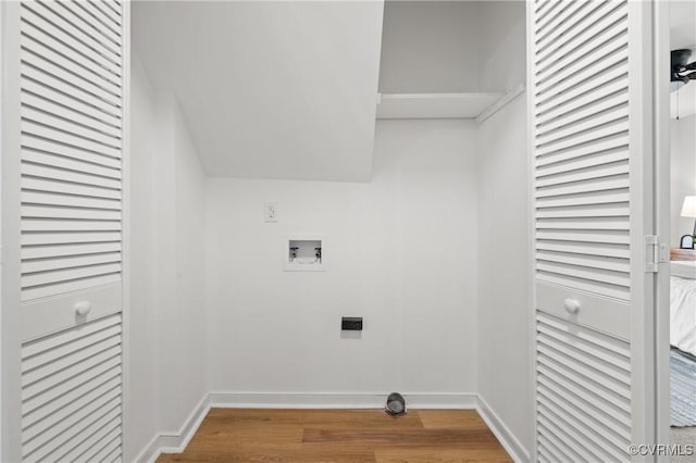 laundry room featuring electric dryer hookup, wood-type flooring, and washer hookup