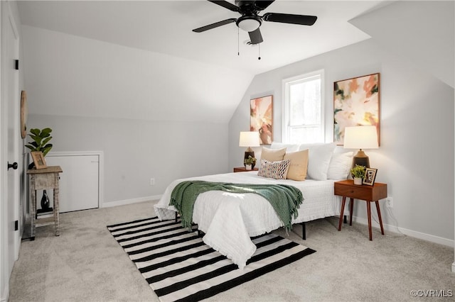 carpeted bedroom featuring ceiling fan and lofted ceiling