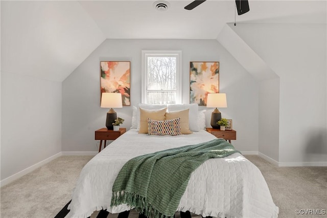 bedroom with ceiling fan, light colored carpet, and vaulted ceiling