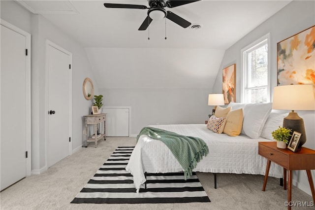 carpeted bedroom with lofted ceiling and ceiling fan