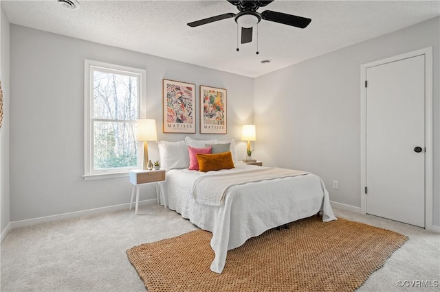 bedroom with light carpet and ceiling fan