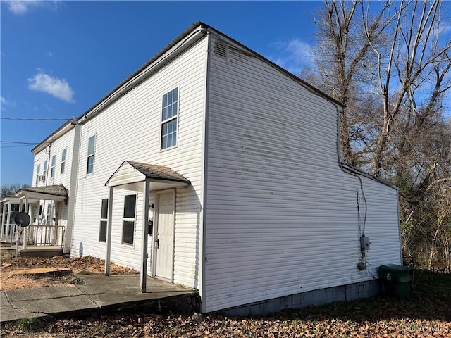 view of property exterior featuring covered porch