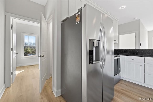 hall with light hardwood / wood-style flooring