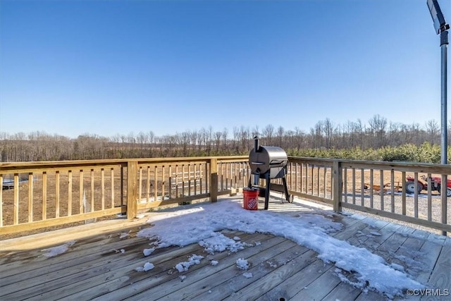 wooden terrace featuring area for grilling