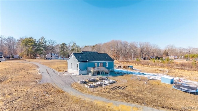 back of house with a wooden deck