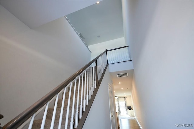 stairs with hardwood / wood-style flooring