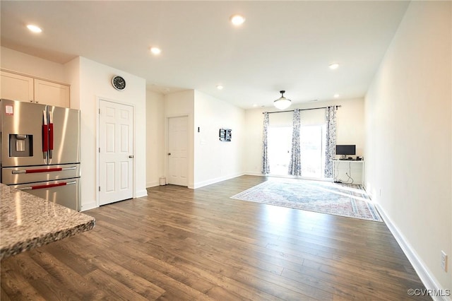 unfurnished living room featuring dark hardwood / wood-style flooring