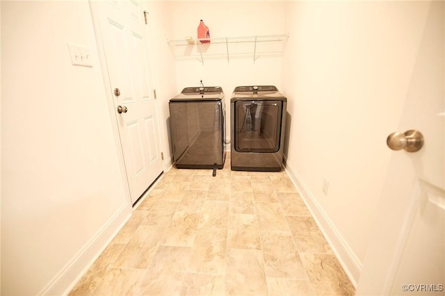 laundry room with washer and clothes dryer