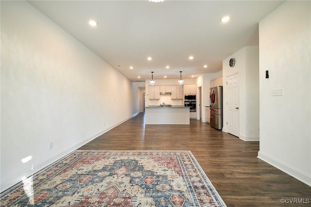 unfurnished living room featuring dark wood-type flooring