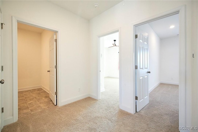 corridor with light colored carpet