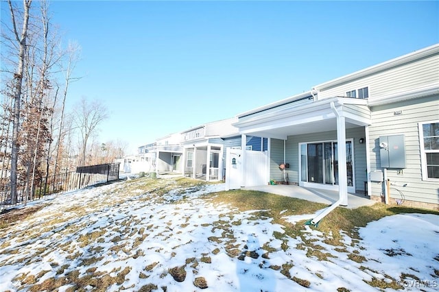 view of snow covered house