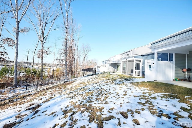 view of yard layered in snow