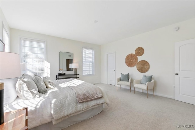 carpeted bedroom with multiple windows