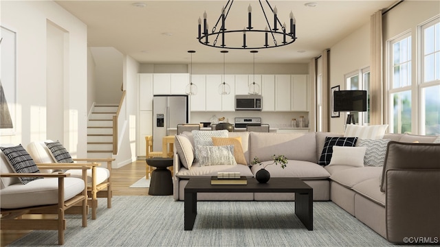 living room with an inviting chandelier and light wood-type flooring