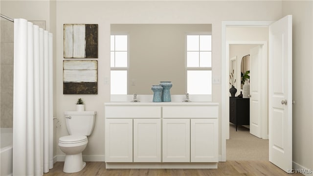 full bathroom featuring hardwood / wood-style floors, shower / bath combination with curtain, vanity, and toilet