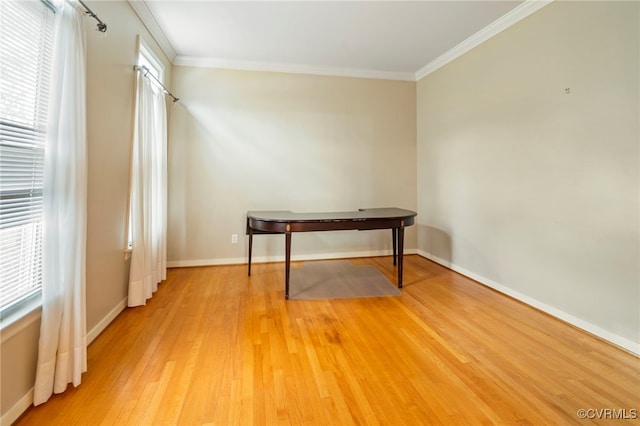 interior space featuring hardwood / wood-style flooring and crown molding