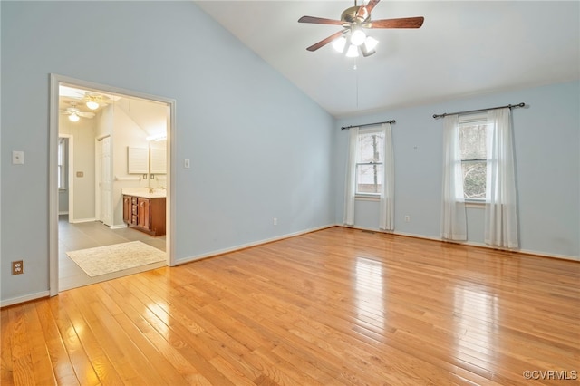 unfurnished room featuring vaulted ceiling, light hardwood / wood-style floors, and ceiling fan