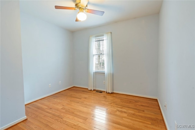 unfurnished room with ceiling fan and light hardwood / wood-style floors