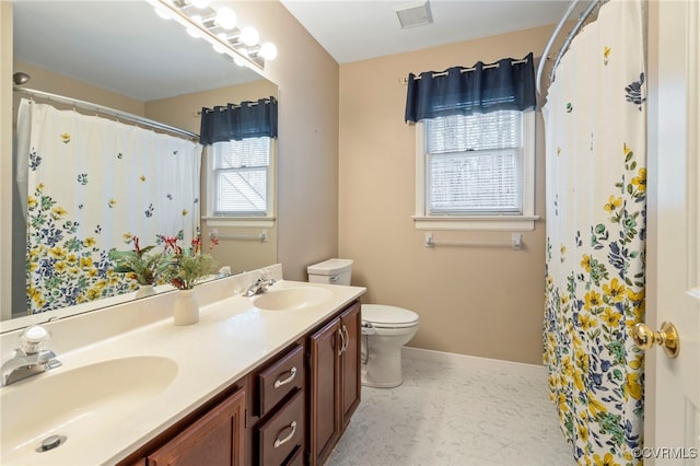 bathroom with a shower with curtain, vanity, and toilet