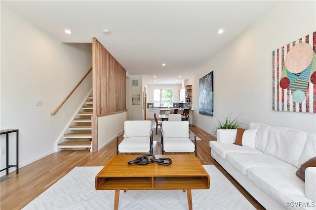 living room with light hardwood / wood-style flooring